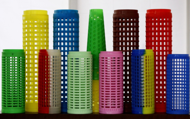 Perforated dye tubes and dye cones